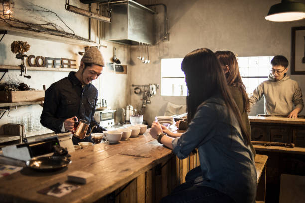 Students learning Japanese together in a Tokyo cafe
